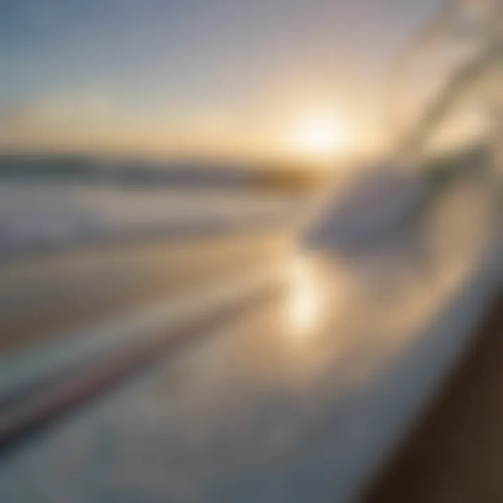 A close-up of a surfboard on the beach with ocean waves in the background, symbolizing the sport's reliance on marine environments.