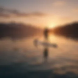 A tranquil sunrise over a calm ocean with a paddleboarder gliding across the water.