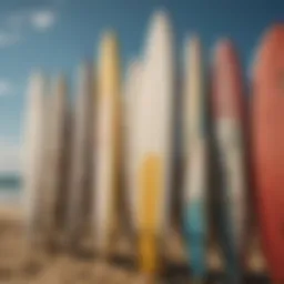 A variety of surfboards lined up on the beach, showcasing different shapes and designs.