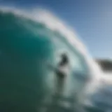 Surfer carving through a wave