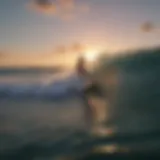 Surfboarder riding a wave at sunset