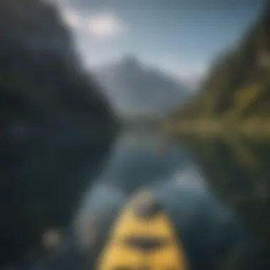 Person paddling on serene lake with mountains in background