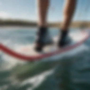 Close-up of windsurfer's foot on board