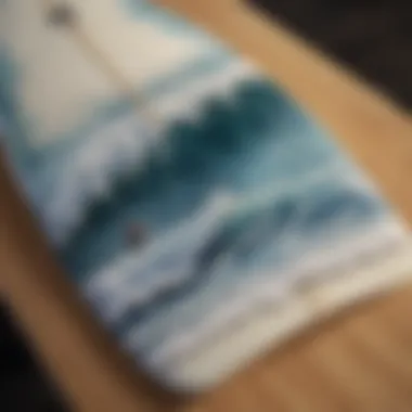 Close-up of a surfboard decorated with Japanese wave imagery, illustrating artistic expression.