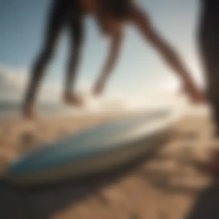 An athlete packing a surfboard into a bag