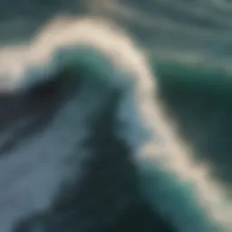 Aerial view of ocean waves breaking over reef