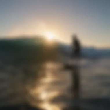 Silhouette of surfer riding a wave at sunset