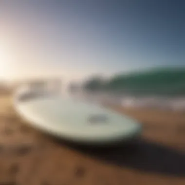 A well-maintained small wave surfboard resting on a beach