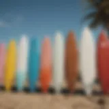 A variety of surfboards displayed on a beach, showcasing different sizes and shapes.