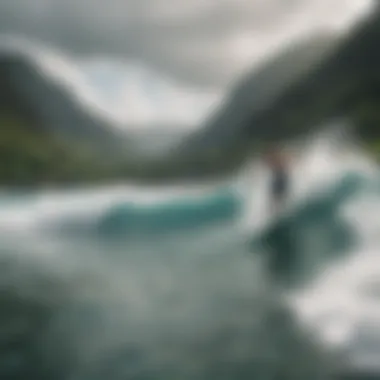 A scenic panorama of surfers riding waves against a backdrop of lush green mountains.