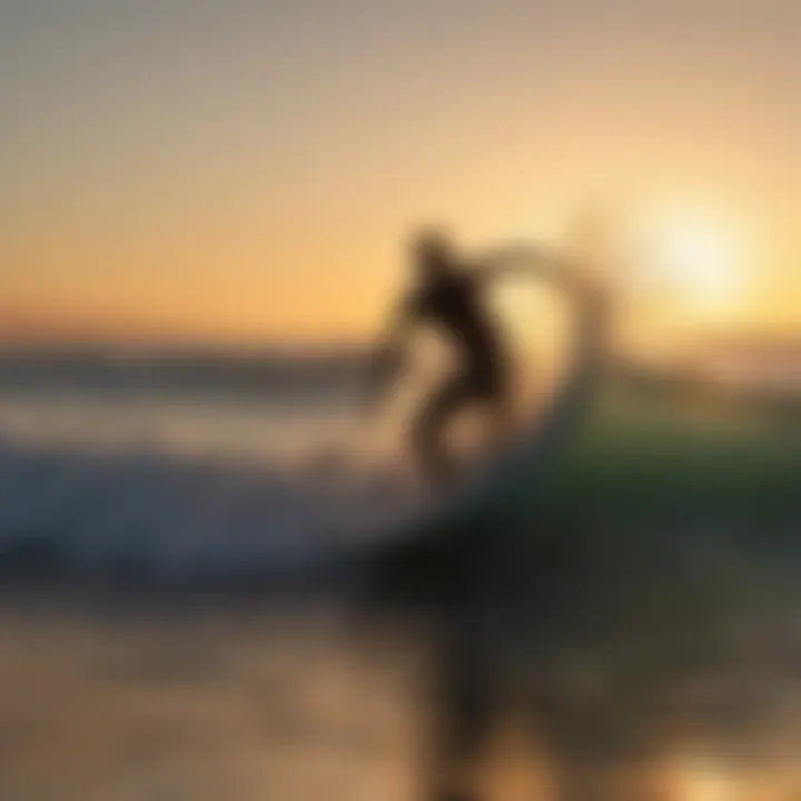 Silhouette of a surfer riding a wave with the sun setting in the background