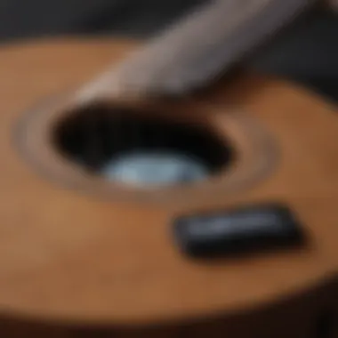 Close-up of a six-string ukulele with a tuning app open