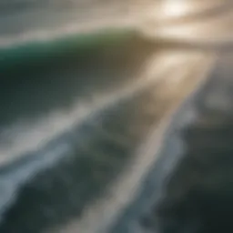 Aerial view of Bali's coastline with surfers riding waves
