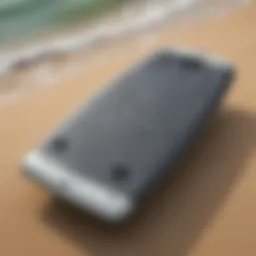A close-up view of a boogie board with handles showcasing its design features