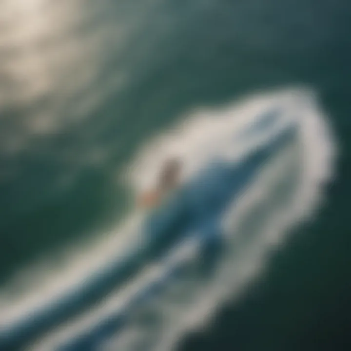 An aerial view capturing the dynamic movement of hydrofoil surfers on the waves.