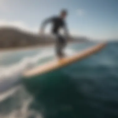 A hydrofoil surfboard gliding effortlessly above the water's surface.