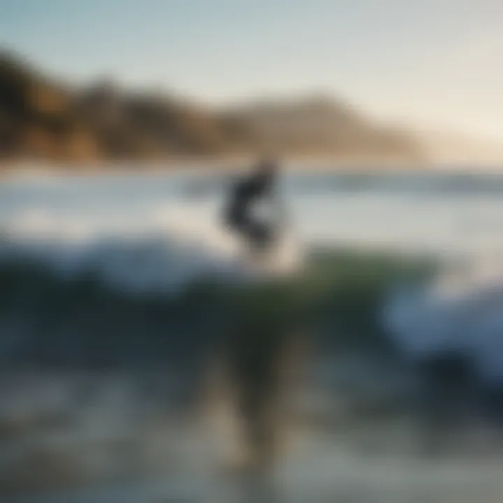 Surfers riding waves at Malibu beach