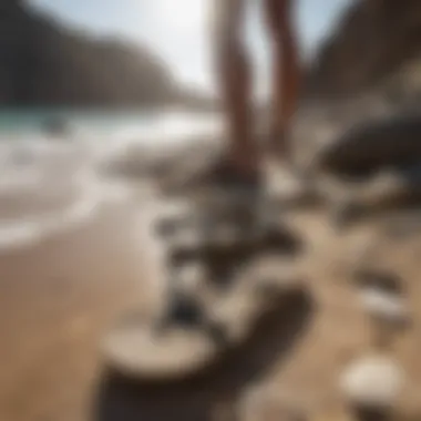 Surfer sandals on rocky shore under the sun