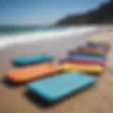 Colorful Morey boogie boards displayed on a beach