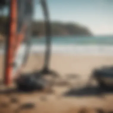 Close-up of specialized kite surf equipment laid out on the beach