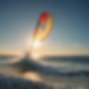 A vibrant kite soaring through the clear blue sky over a serene ocean