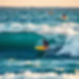 Surfer riding the waves at Padang Padang Beach