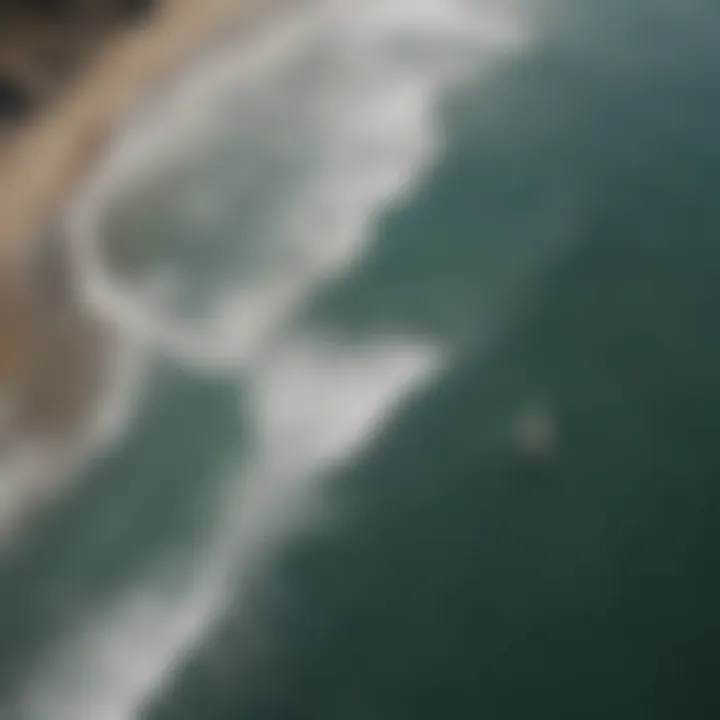 Aerial view of San Carlos coastline with surfers catching waves