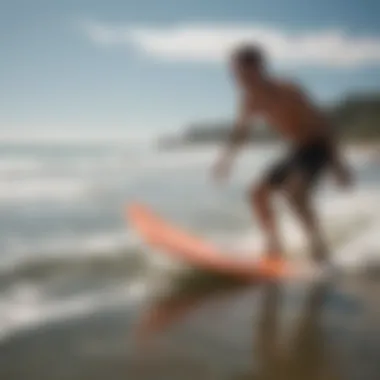 A beginner enjoying skimmer boarding in shallow water.