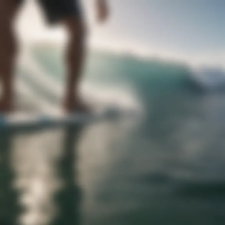 A close-up of a surfer's feet on a surfboard with ocean spray