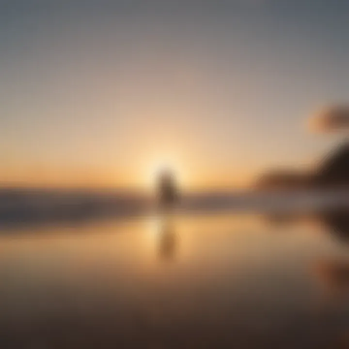 Surfer silhouetted against the sunrise at Santa Teresa Beach