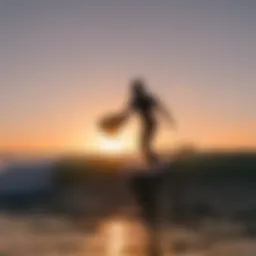 Sunset silhouette of a surfer at Venice Beach