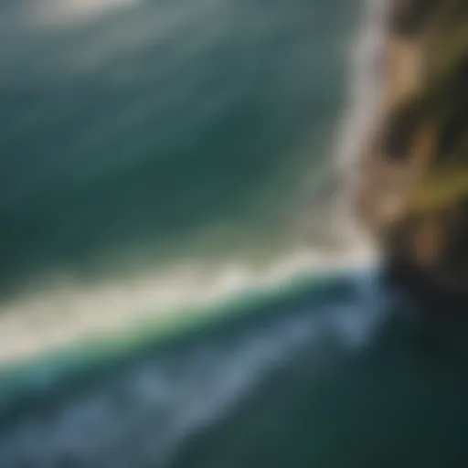 Aerial view of a surfer catching a wave in Montañita