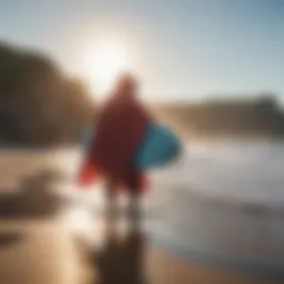 A surfer effortlessly changing under a vibrant poncho by the beach