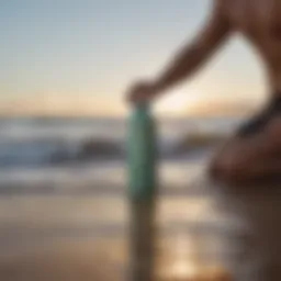 A surfer enjoying a refreshing drink from a Hydro Flask on the beach.