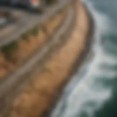An aerial perspective of a coastal area affected by erosion before and after seawall construction
