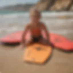 A vibrant selection of child-sized bodyboards showcased on a sandy beach.