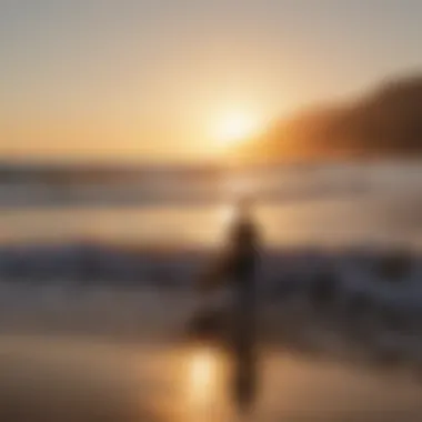 Surfers enjoying the sunset at Malibu Beach