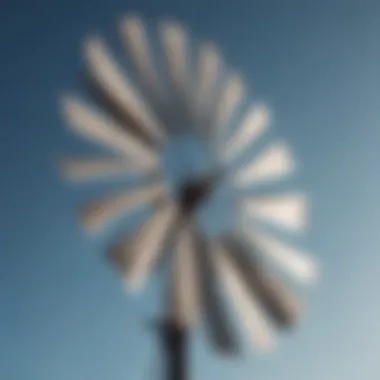 Windmill blades in motion against a clear sky