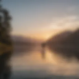 A serene landscape showcasing a paddleboarder gliding across calm waters at sunrise.