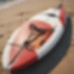 Surfboard bungee strap attached to board on beach