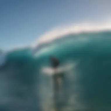 Surfer catching a perfect wave at Kapalua Beach