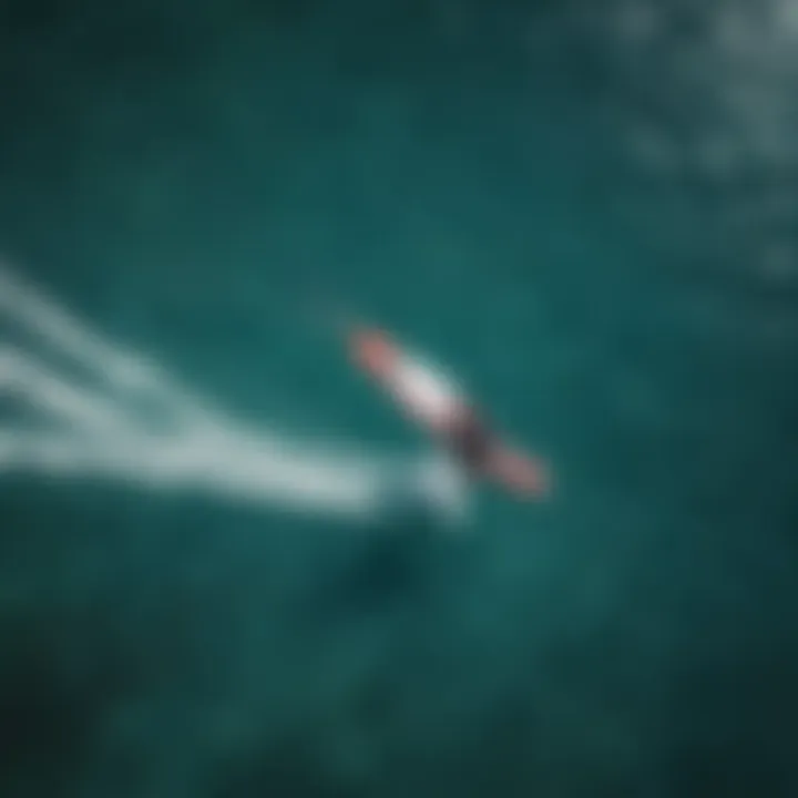 Aerial view of kite surfers on crystal clear water