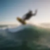 Aerial view of kitesurfer riding the waves