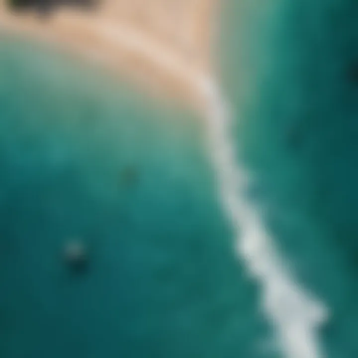 Aerial view of kitesurfing board and kite on turquoise waters