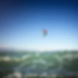 A kitesurfing kite soaring high above the ocean