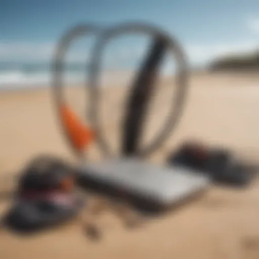 Kitesurfing gear laid out on beach sand