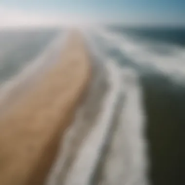 Aerial view of kitesurfers gliding across the waves in the Outer Banks