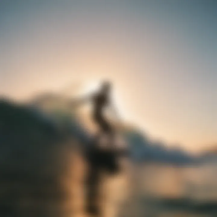 Silhouette of a surfer catching a wave during golden hour