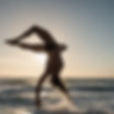 Silhouette of acrobat mid-air during back flip