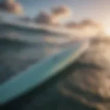 A close-up of a surfboard on the ocean surface highlighting its design features.